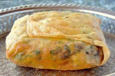 an omelet sitting on top of a glass plate