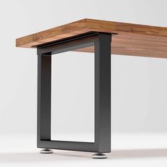 a wooden table sitting on top of a metal frame