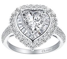 Show off your romantic side with the stunning glam style of this heart halo statement ring. It shines with sterling silver and cubic zirconia Diamonique simulated diamonds. Glamorous White Diamond Ring For Anniversary, Glamorous White Diamond Anniversary Ring, Elegant Heart Ring With Halo Setting For Formal Events, Elegant Heart Shaped Ring With Halo Design, Glamorous Cubic Zirconia Diamond Ring For Anniversary, Formal Heart Ring With Center Stone In Cubic Zirconia, Dazzling Heart Shaped Diamond Ring With Cubic Zirconia, Elegant Formal Heart Ring With Halo Setting, Formal Heart Ring With Halo Setting