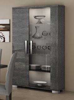 a glass door cabinet in a dining room