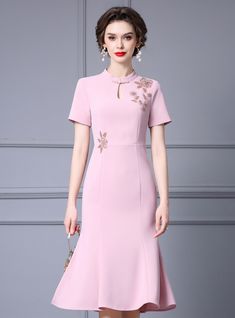 Loving the idea of a dress that blends elegance with modern details? This mother of the bride dress is the perfect choice. The soft pink hue is both refined and celebratory, ideal for making a memorable impression. This dress features a high neckline with a keyhole detail, embellished with delicate beadwork, adding a touch of glamour. The floral appliqu�� on the bodice provides a unique and feminine touch. Made from premium materials, this dress guarantees a comfortable fit and fluid movement, perfect for mingling and dancing. The tailored silhouette enhances your natural curves, providing a flattering and feminine look. Complete your outfit with statement accessories and a chic clutch to enhance the overall elegance. This dress is not just an outfit; it is a celebration of style and grace Wedding Day Dresses, Mermaid Shorts, Dress Puff Sleeve, Pink Mermaid, Vintage Gowns, Stunning Gowns, Mother Of The Bride Dress, Half Price, Gown Dress