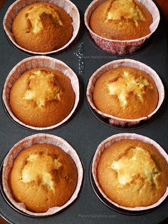 six muffins sitting in the middle of a pan on top of a table