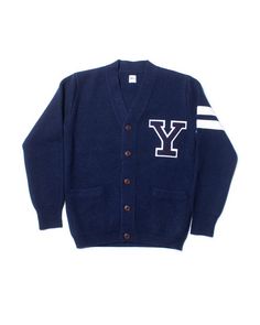 a blue cardigan sweater with the letter y on it and white stripes around the sleeves