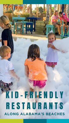 kids playing in foam balls at the beach with text overlay reading kid - friendly restaurants along alabama's beaches