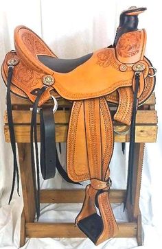 a saddle that is sitting on top of a wooden stand