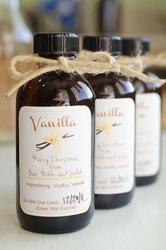 three bottles of vanilla syrup tied with twine on top of a white countertop