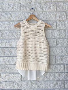 This chunky knitted tank top has a high neck and a relaxed fit. in the back the top half continues the knitting style then finishes with an airy cotton back hem.    70% cotton 30% polyamide    length 25" Second Child, American Rag, Classic Outfits, Veronica Beard, Knitted Tank Top, Fit In, Womens Tank, Crochet Top, Latest Trends