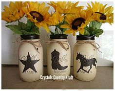 three mason jars with sunflowers in them