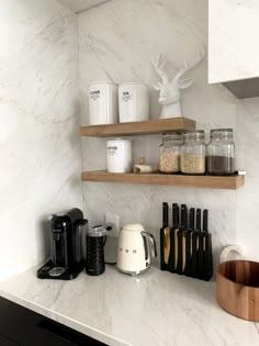 the kitchen counter is clean and ready to be used for cooking, including coffee makers