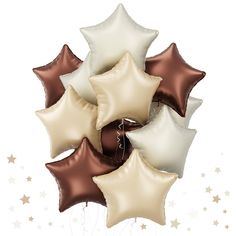 a bunch of brown and white star balloons