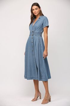 -Color: Denim -V-neck collar -Short sleeves -Side pockets -Elastic waist -Opening on back -Front button closure -Content: 100% Cotton -Hand wash/ Hang to wash -Runs true to size -Imported -Model is wearing a size Small V-neck Denim Dress With Pockets, Denim Blue Short Sleeve Dresses With Pockets, Summer Washed Collared Dress, Summer Collared Washed Dresses, Medium Wash Denim Short Sleeve Dress, Washed Blue Short Sleeve Dress With Pockets, Medium Wash Denim Dress With Short Sleeves, Medium Wash Denim Dresses With Short Sleeves, Blue Denim Short Sleeve Dress With Pockets