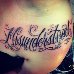 a woman's stomach with the word mississippi tattooed on her lower side ribcage