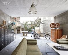 a living room filled with furniture and lots of bookshelves next to a fire hydrant