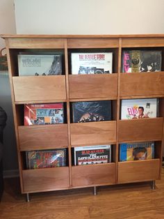 a wooden book shelf filled with lots of books