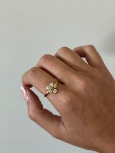 Flower ring - This adjustable dainty flower ring is incredibly stunning. Made to sparkle and shine on any finger! A perfect gift for women, girlfriend, best friends, sisters, moms. A perfect option for those who like minimal dainty gold rings and want to have the perfect size. - gold filled - stainless steel and gold - cz stones - minimalist - adjustable WHY VASI Jewelry? - Ethically sourced gems and stones - Made with recycled gold - Handmade or designed/sourced - Shop local (based in Chicago) Floral Jewelry For Spring Weddings, Dainty Cluster Ring For Anniversary, Dainty Jewelry For Anniversary In Spring, Dainty Jewelry For Spring Anniversary, Dainty Spring Jewelry For Anniversary, Rose Gold Jewelry For Anniversary In Spring, Rose Gold Jewelry For Spring Anniversary, Spring Wedding Jewelry In Flower Shape, Dainty Gold Flower Stackable Rings