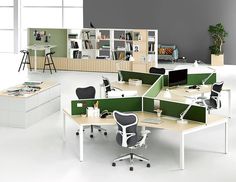 an office with multiple desks and chairs in it