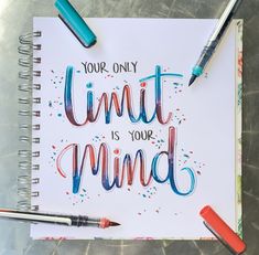 an open notebook with the words your only limit is your mind written on it next to some markers