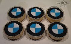 six cupcakes with blue and white designs on them