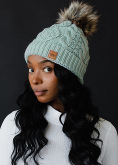 Light blue cable knit hat Natural faux fur pom accent Fleece lined Crown patch on the left side One size 100% Acrylic Knitted Hats Kids, Knit Hat For Men, Knit Jewelry, Cable Knit Hat, Blouse Tank Top, Dangle Necklaces, Pom Pom Hat, Knitting For Kids, Fur Pom Pom