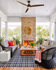 a living room filled with furniture and a fire place