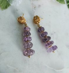 Carved Flower Amethyst 24 K Gold Filled Long Post Earrings, Amethyst Jewelry Gift, Natural Amethyst Gemstones, February Birthstone. These unique earrings have a drop length of 2" ( 50 mm.) and have ornate french 24 K gold filled. Precautions when purchasing *The color may look different on the screen than in the actual product. *Products using natural stone may have inclusions or cracks.  Please understand that it is also a unique feature of natural stone. * Processing time is 3 - 5 days.  * US Amethyst Crystal Earrings For Jewelry Making, Amethyst Gemstone Crystal Earrings For Jewelry Making, Lavender Amethyst Earrings With Natural Stones, Purple Amethyst Spiritual Earrings, Spiritual Amethyst Purple Earrings, Spiritual Purple Amethyst Earrings, Round Amethyst Earrings With Natural Stones, Gold Amethyst Crystal Earrings, Gold Amethyst Gemstone Crystal Earrings