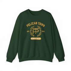 A college style crewneck sweatshirt representing Stardew Valley's Pelican Town These garments are made from polyester and cotton. This combination helps designs come out looking fresh and beautiful. The collar is ribbed knit, so it retains its shape even after washing. There are no itchy side seams on these sweaters.  .: Made with a medium-heavy fabric blend of 50% cotton and 50% polyester (8.0 oz/yd² (271.25 g/m this sweatshirt feels cozy and is the perfect choice for those colder months. .: Th Spring Sweatshirt, Confident Style, Biscuits And Gravy, Golf Fashion, Fantasy Football, Mens Tee Shirts, Trombone, Pullover Shirt