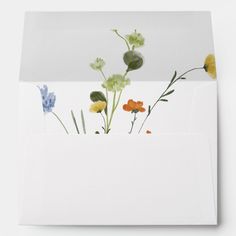 an envelope with flowers painted on it