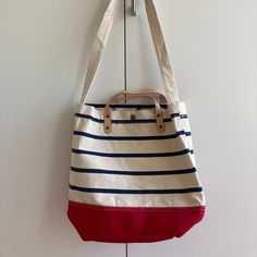 Super Cute Striped Canvas Bag With Two Nubuck Leather Handles And Canvas Shoulder Strap. The Bag Snaps Closed. Unlined Interior. It Has A Large Zippered Inner Pocket, Which Is 7.5" X 10". Looks Really Sturdy - Could Probably Carry Your Laptop And More - And Would Be Cute With So Many Outfits! 100% Cotton, Machine Washable :) Approx Dims: 12" Tall X 15" Wide X 5" Shoulder Strap Drop 16" All Reasonable Offers Considered. Thanks For Shopping! Nautical Navy Bag For Everyday Use, Everyday Nautical White Bag, Nautical Style Navy Bag For Everyday Use, White Nautical Everyday Bag, Nautical Style Bag For Everyday Summer Use, Nautical Canvas Bags For Everyday Use, Everyday Nautical Canvas Bags, White Nautical Canvas Bag, White Nautical Canvas Bags