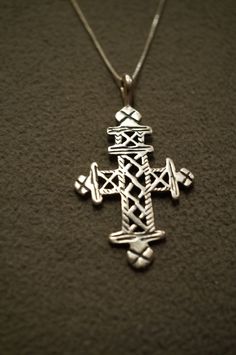 I am offering you this spectacular genuine sterling silver necklace and pendant charm. This piece is completely unique with the following features:. Sterling silver fancy etched and scrolled cross pendant charm. It hangs on a 20 inch box link chain necklace. What Stunning detailing we have here. The Pendant measures app. 2 by app. 1 inches. It weighs app. 12 grams ! This is in a classic, yet very distinct bold necklace. There is tons of sparkle and shine with this piece. Buyer pays all shipping Unique Silver Cross Pendant Necklace, Unique Silver Necklace With Cross Pendant, Unique Sterling Silver Cross Necklace, Sterling Silver Cross Necklace, Sterling Silver Wedding Band, Bold Necklace, Religious Cross, Art Deco Pendant, Silver Cross Pendant