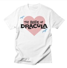 Now on THREADLESS! Unveil your dark side with a twist of pink! 💖🦇 Introducing 'The Bride of Dracula in Pink' t-shirt by Rachel O'Donnell. This striking design merges the elegance of the gothic bride with a touch of whimsy, making it perfect for those who dare to be different. Let your style speak volumes as you embrace your love for the macabre with this captivating tee. Own your uniqueness and make a statement wherever you go! Bride Of Dracula, Retro Wedding Inspiration, Vampire Style, Vintage Wedding Ceremony, Goth Bride, Bride Tee, Gothic Bride, Dare To Be Different, The Gothic