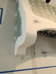 the interior of a building that is being painted white