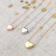 "Lovely dainty gold heart pendant on a delicate necklace. Simply elegant and cute for everyday wear. It is a perfect gift for yourself and your loved ones.  Great for bridesmaid gifts, graduations, birthdays, Mother's Day and for all other meaningful gifts.  Our quality hand-crafted necklaces are carefully handmade one at a time with love. ENTER OUR SHOP HERE for more beautiful jewelry :  https://www.etsy.com/shop/MillyStreet Here's How to Order: - Select your quantity in the 1st drop-down menu. - Select your length and color in  2nd drop-down menu - Select your finish: Gold, White, Rose Gold  - Measures: Width 8mm and Height 7mm  - Chain length: available from 16 inches from 20 inches - Length includes the heart, measured end to end - Shown at 16\" in photo 1  - Chain & Charm: Gold Plated Heart Necklace Gold, Custom Initial Necklace, Heart Rose, Everyday Gifts, Heart Pendant Gold, Gold Heart Necklace, Cute Heart, Handcrafted Necklace, Silver Plated Jewelry