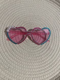 pink heart plastic glasses with letter beads& flat back glass crystals. Embellished by hand individually.  Adult size. Not intended for children. Not actual sunglasses, more of fashion glasses. Decorated Heart Glasses, Bedazzled Heart Sunglasses, Pink Fun Sunglasses With Glass Lenses, Pink Heart-shaped Sunglasses As Gift, Heart-shaped Pink Sunglasses As Gift, Heart-shaped Pink Sunglasses For Gift, Fun Pink Glass Sunglasses, Pink Heart-shaped Party Sunglasses, Personalized Pink Sunglasses For Party