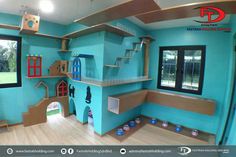 this is an image of a playroom in a child's room with blue walls and wood flooring