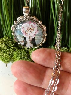 "Bridesmaid Gifts, Paris Theme Favors, Designer Favors, Flower Fairy Necklace, Flower Lady Pendant, Flower Necklace, Flower Pendant, Flower Jewelry This fashionable necklace is sure to be a favorite for who love fashion. Each piece is created from vintage illustrations Pendant is approx. 1 ½\"x 1 ½\" detailed silver pendant. It comes with a 30\" oval 3mm chain . You can make chain different lengths by clipping clasp into the loops of the necklace to get the perfect length depending on your outfi Artistic Pink Jewelry For Party, Artistic Pink Party Jewelry, Artistic Flower Jewelry For Wedding, Artistic Flower Jewelry For Weddings, Artistic Pink Flower Jewelry, Pink Flower Jewelry For Celebration, Handmade Pink Flower Necklace For Party, Pink Flower Necklace For Wedding, Pink Round Pendant Necklace For Wedding