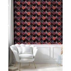 the wallpaper in this room is decorated with red and black floral design, which has been