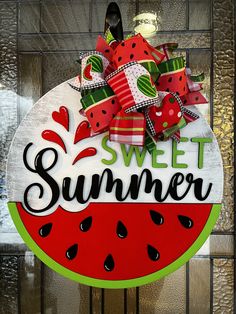 a sign that says sweet summer with watermelon slices and polka dots on it