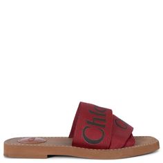 100% authentic Chloé Woody slide sandals in cherry red canvas webbing with black logo. Feature brown rubber soles and leather logo patch. Have been worn and are in excellent condition. 2021 Measurements Imprinted Size 35 Shoe Size 35 Inside Sole 22cm (8.6in) Width 7cm (2.7in) All our listings include only the listed item unless otherwise specified in the description above. Summer Sandals With Logo Strap And Round Toe, Casual Summer Sandals With Logo Strap, Casual Leather Sandals With Logo Strap, Casual Sandals With Logo Strap For Spring, Flat Sandals With Logo For Summer, Logo Slip-on Sandals For Summer, Logo Open Toe Sandals For Summer, Summer Slip-on Sandals With Logo, Summer Flat Sandals With Logo