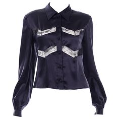 This Valentino vintage midnight blue silk blouse has beautiful inset fine lace and knotted fabric buttons. The silk is so luxurious and the top is in excellent condition. This top has the Miss V Valentino label and is from an estate we acquired that had one of the finest Valentino collections we've ever come across. Considered a lower price point line, it's incredible that the quality is so fine and the details so exquisite. Once you buy a vintage silk blouse from this time period, you will unde Alexander Mcqueen Vintage, Valentino Blouse, Blue Silk Blouse, Valentino Vintage, Valentino Collection, Black Silk Blouse, Valentino Black, Vintage Blouse, Lace Insert