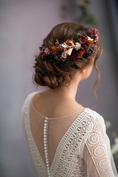 a woman wearing a flower crown in her hair