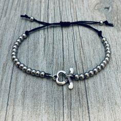 SPORTS BRACELET - Silver Plated Beads with Sports Charm on Adjustable String Bracelet ADJUSTABLE SIZING: No need to worry about picking the correct size.This bracelet is a one size fits all with and adjustable slip knot closure. GIFT - Looking for an inexpensive gift? Our bracelets are the perfect gift for birthday, tournament, end of season, Christmas or just because Click Add To Cart and get yours today! Sports Bracelet, Jewelry Making Bracelet, Inexpensive Gift, String Bracelet, Bracelet Collection, Adjustable Bracelet, Silver Bracelets, Charm Jewelry, Rope Bracelet