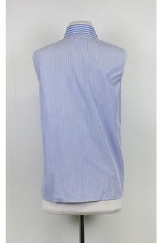 The perfect lightweight blouse for everyday wear. Great for pairing with skinny jeans or shorts. Add a sandal and cross-body handbag for a casual chic look. Size 10 (IT 40) 100% cotton Made in Italy Collar Button down front Ruffles on bust Shoulder to hem 25.75" Miu Miu Tops For Spring Workwear, Miu Miu Casual Tops For Workwear, Casual Miu Miu Tops For Spring, Blue Summer Shirt For Everyday Wear, Chic Blue Everyday Blouse, Chic Everyday Blue Blouse, Blue Summer Workwear Tops, Blue Spring Shirt For Everyday, Versatile Everyday Summer Shirt