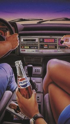 two people sitting in the driver's seat of a car, one holding a bottle of pepsi