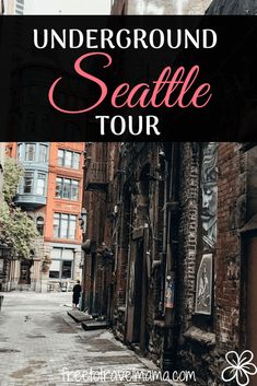 an alleyway with the words underground seattle tour overlayed in pink and black