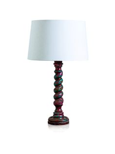 a table lamp with a white shade on it's base and a wooden base