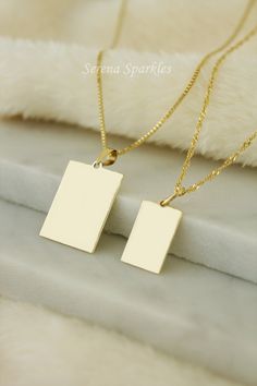 10k Solid Gold Engravable Tag Necklace, Real Gold Tag Pendant, Gold Rectangle Tag Pendant, Dog Tag, Personalized Tag Pendant, Engravable Gold Charm Available in 2 different sizes Small & Large. A Perfect Minimalist Look Personalized Products will not be exchanged or refunded. Metal: Solid Gold Gold Purity: 10k Stamp: 10k or 417 (417 Stamp means 10-karat gold) PENDENT DIMENSIONS Small Length: 15mm Width: 10mm Thickness: 0.40mm Large  Length: 19mm Width: 15mm Thickness: 0.40mm CHAIN THICKNESS Cabl Personalized Rectangular Pendant Jewelry, Personalized 14k Gold Rectangular Necklace, White Engraved Rectangular Necklace, Personalized Rectangular Jewelry For Memorial, White Rectangular Engraved Necklace, Personalized White Rectangular Jewelry, Classic Rectangular Jewelry For Personalized Gifts, Personalized Gift Rectangular 14k Gold Jewelry, Personalized Yellow Gold Rectangular Necklace