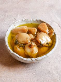 a white bowl filled with food on top of a table