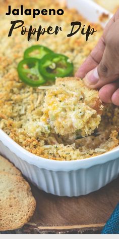 someone scooping some food out of a casserole dish with cheese and green peppers