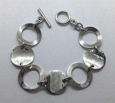 "Vintage sterling silver circle links bracelet measures 7\" long and 3/4\" wide in good vintage condition with some light wear item comes with box when shipped." Adjustable Silver Chain Bracelet, Silver Metal Bracelet Stamped 925, Silver 925 Stamped Metal Bracelet, Adjustable Sterling Silver Bracelet Stamped 925, Silver Round Bracelet Stamped 925, Silver Sterling Silver Round Chain Bracelet, Stamped 925 Silver Round Bracelets, Sterling Silver 925 Stamped Chain Bracelet, Silver Sterling Silver Chain Bracelet