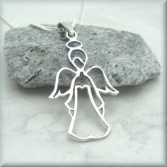 "This cute little guardian angel can watch over you and protect and guide you. Sterling silver curb chain. The angel measures about 1\" long (2.54 cm). Including the bail, the pendant is about 1 1/4\". Items are shown larger in pictures to show detail - please note the dimensions. Jewelry is packaged in a cotton lined box for gift-giving. See more Bonny Jewelry at http://bonnyjewelry.etsy.com If this is a gift and you would like to include a short note with the item, please include this informat Angelic Sterling Silver Jewelry For Gifts, Silver Angelic Jewelry For Gift, Angelic Silver Jewelry For Gift, Easter Necklace, Guardian Angel Necklace, Necklace Friendship, Faith Necklace, Blue Sapphire Necklace, Friendship Necklace